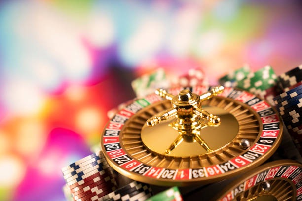 Live dealer casino studio with roulette wheel and cards